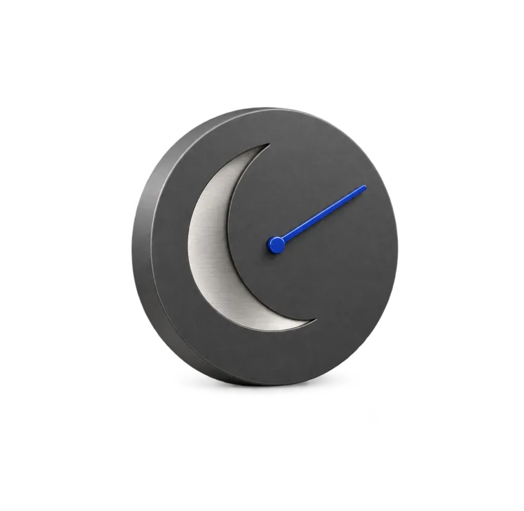 A graphite clock with a crescent moon and a blue hand